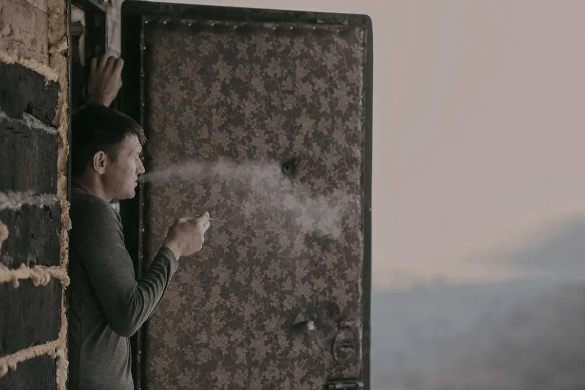 Chegdomyn, Russia. 2022. A private house on the edge of a cliff, beyond which taiga and open-pit coal mines stretch for dozens of kilometers.