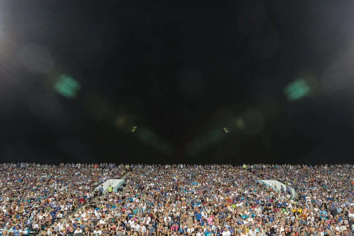 Fans at the old Rotor stadium during a football match.
