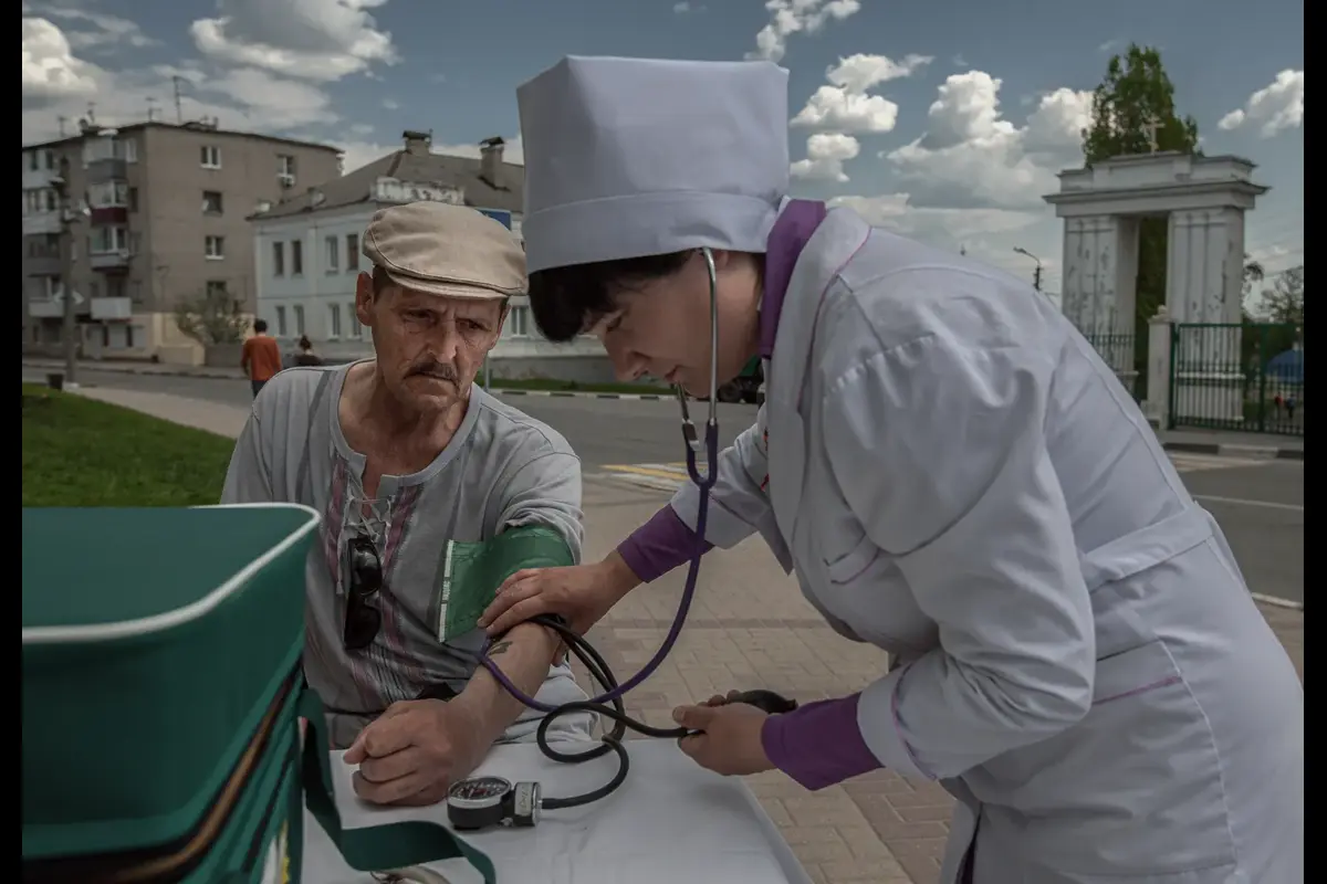 People drink heavily during the holidays, but on this day the city authorities showed special care by deploying street nurses. The man’s blood pressure is 170/110; he refused medication.