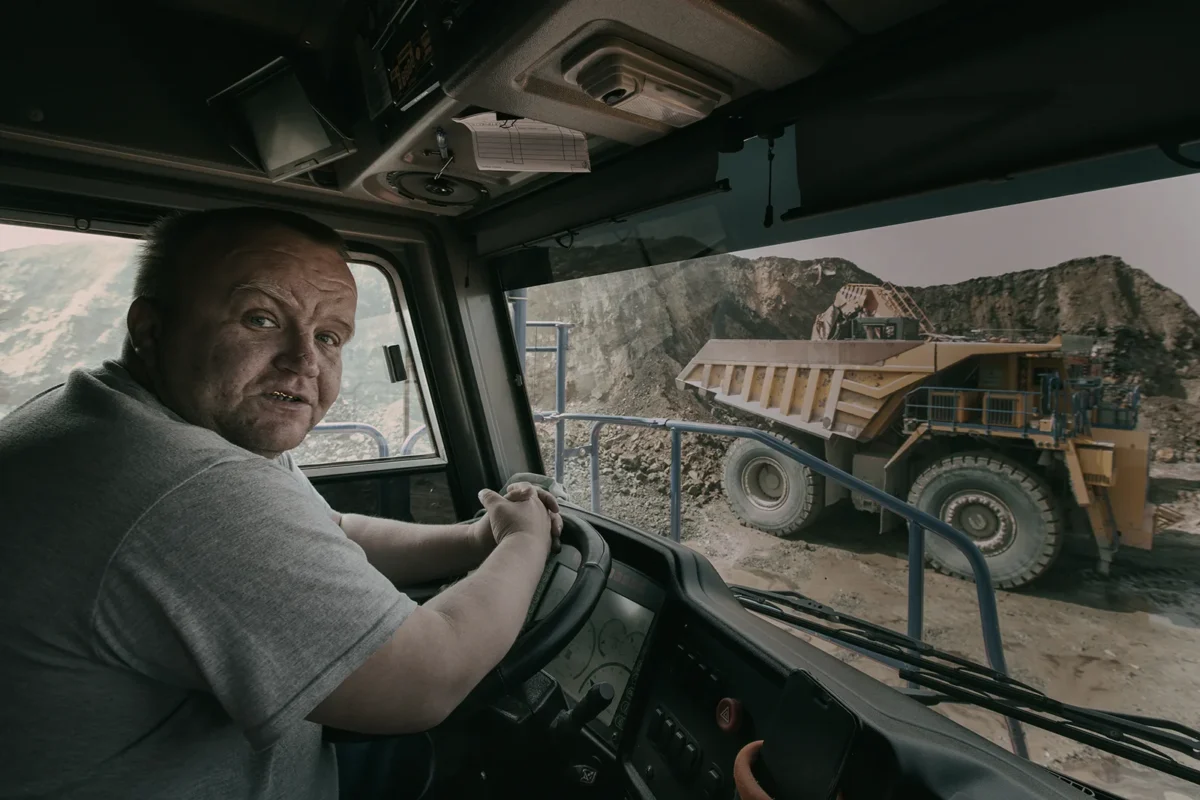 Russian Far East. Chegdomyn, Russia. 2022. Driver of a 220-ton open-pit mining dump truck.