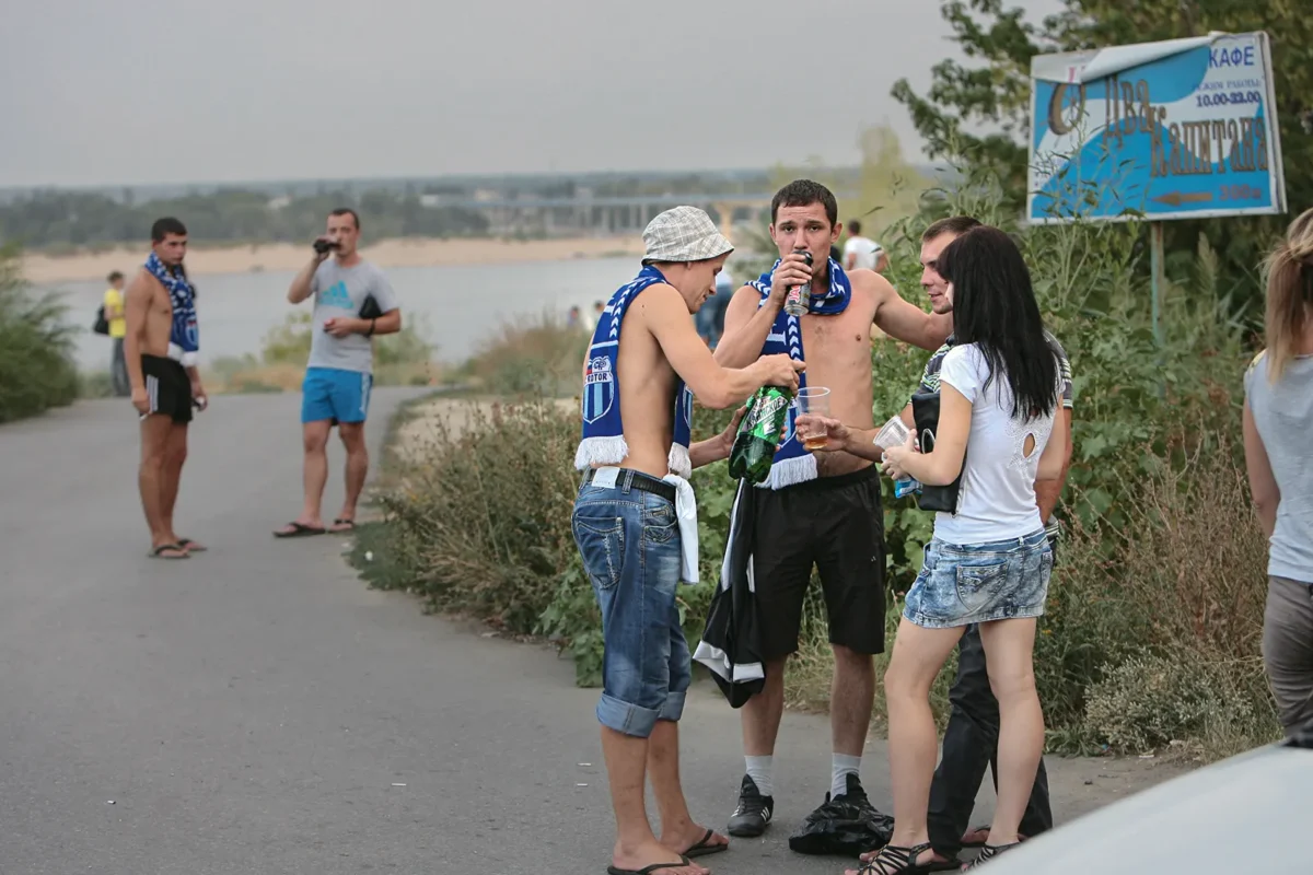 Fans on match day in front of the stadium on the bank of the Volga river.